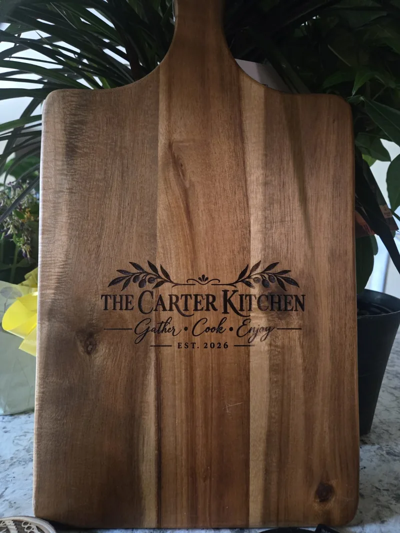 Personalized Carter Kitchen wooden cutting board engraved with a family name and established year