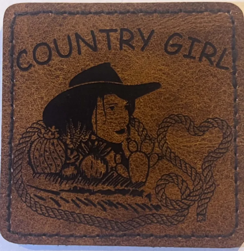 Country Girl western patch with an engraved cowgirl and flowers