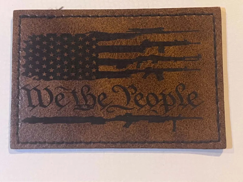 Rectangular We the People patch with an engraved American flag