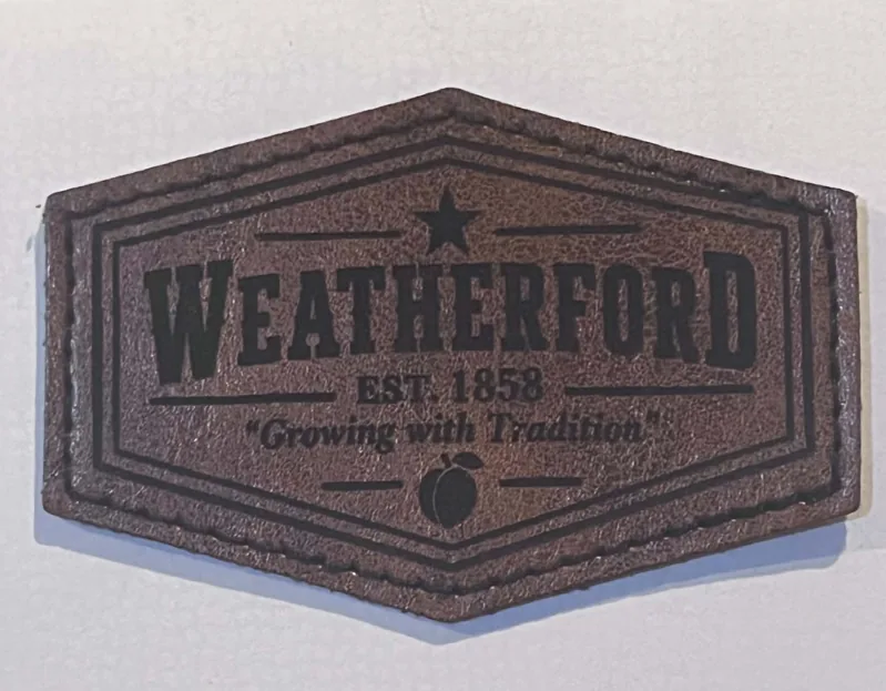 Weatherford patch with detailed engraved lettering and a stitched border